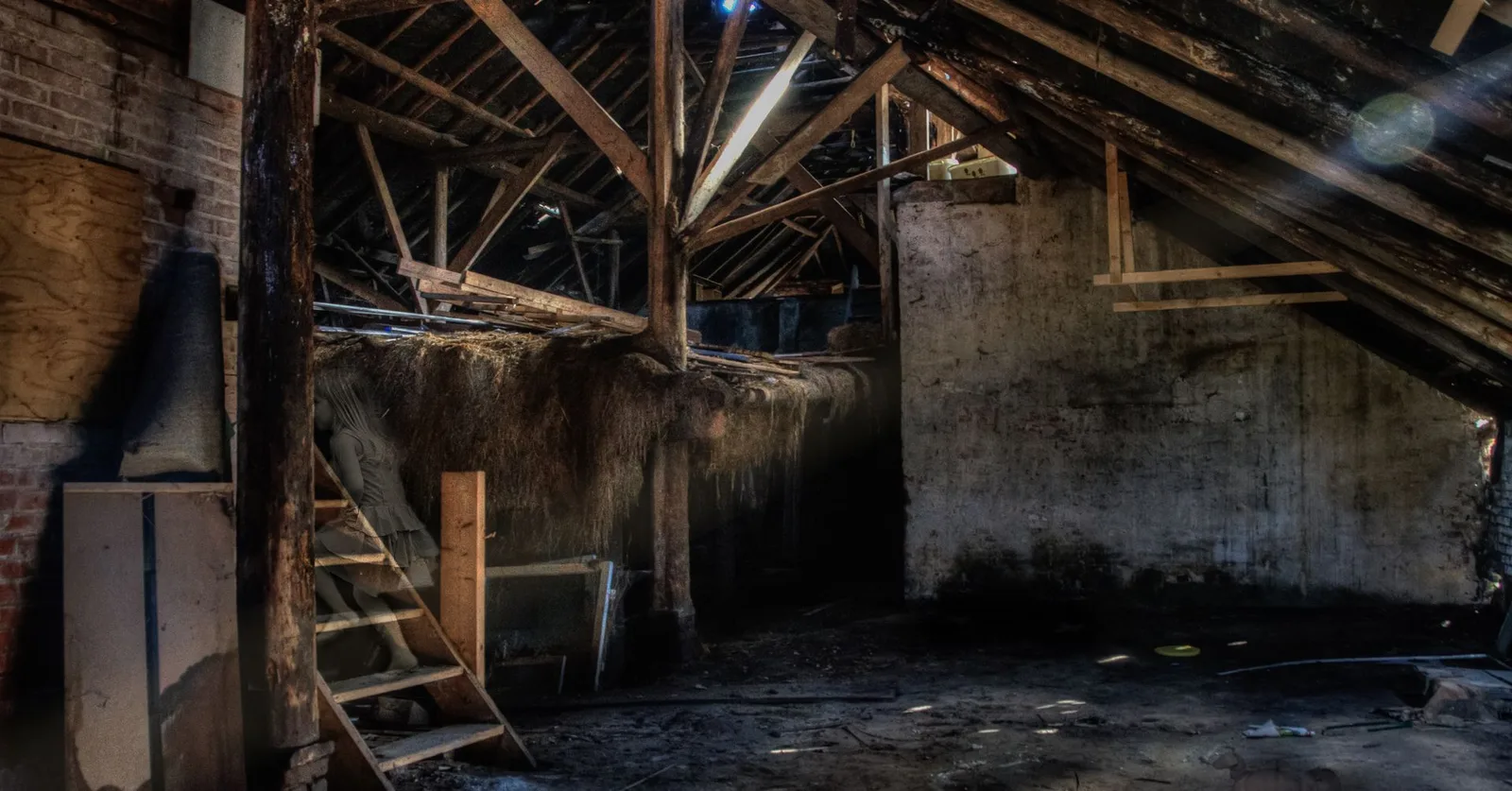 Sunlit abandoned attic showcasing rustic wooden beams and dust, creating an eerie atmosphere