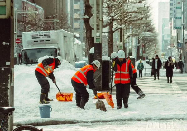 storm-damage-property-survey-dublin-wicklow Urban street with workers shoveling snow